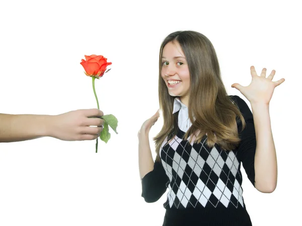 Teen girl rejoice in red rose — Stock Photo, Image
