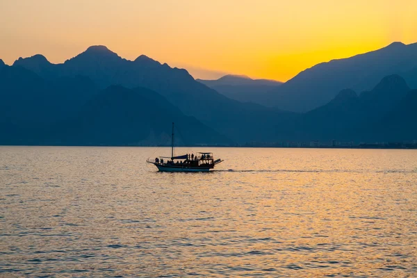 Ship in bay at sunset. — Stock Photo, Image