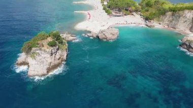 Sveti Nikola Saint Nicholas Island from drone in blue adriatic sea, Budva tourist resort, Montenegro