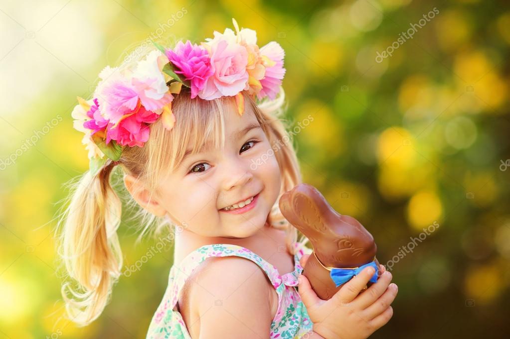 Cute easter girl with chocolate bunny — Stock Photo © fotoskaz 43451691