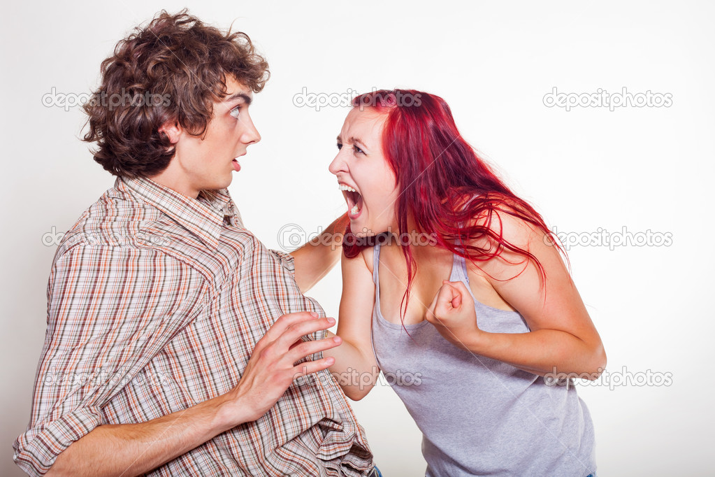 Man menacingly screaming at the phone Stock Photo