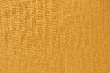 Sıcak tekstil arkaplanı için sarı örülmüş malzeme dokusu.