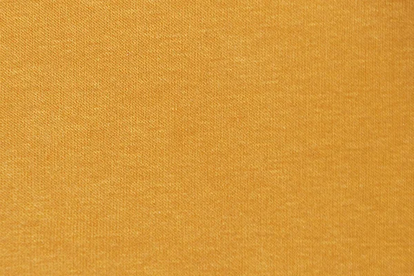 Sıcak tekstil arkaplanı için sarı örülmüş malzeme dokusu.