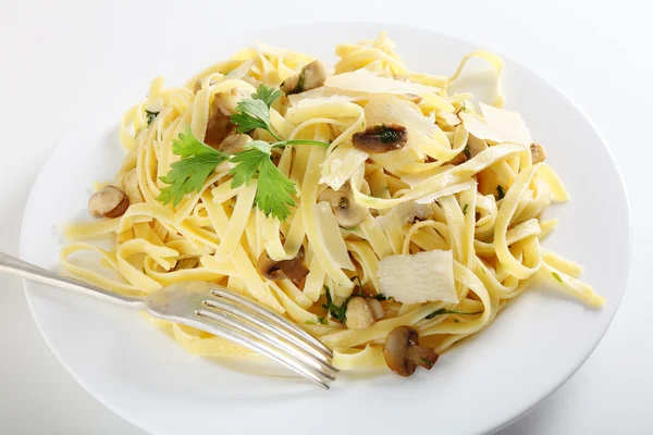 Pasta ai funghi with fork — Stock Photo, Image