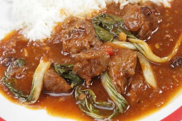 Curried lamb with bok choi — Stock Photo, Image