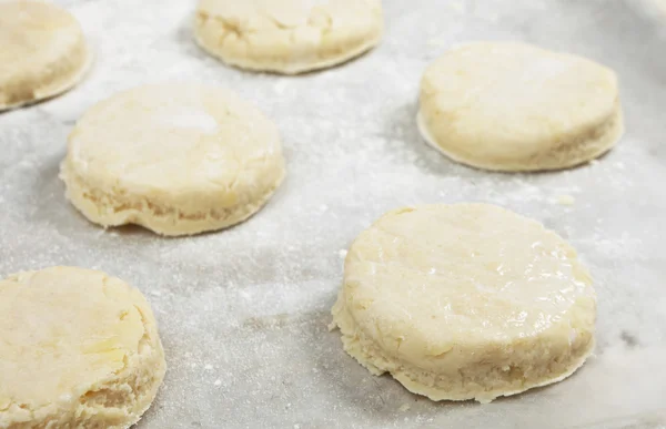 Raw scones on a baking sheet — Stock Photo, Image