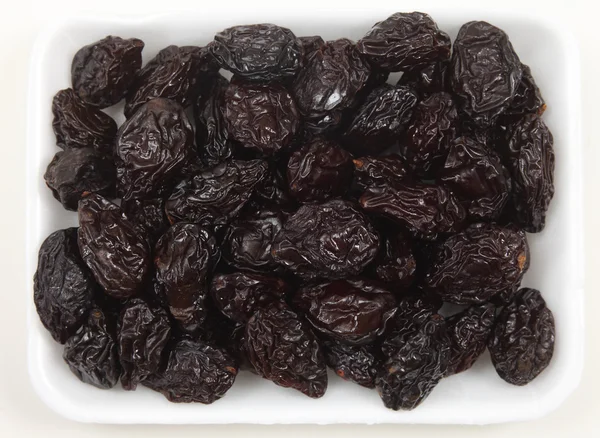 Tray of prunes from above — Stock Photo, Image