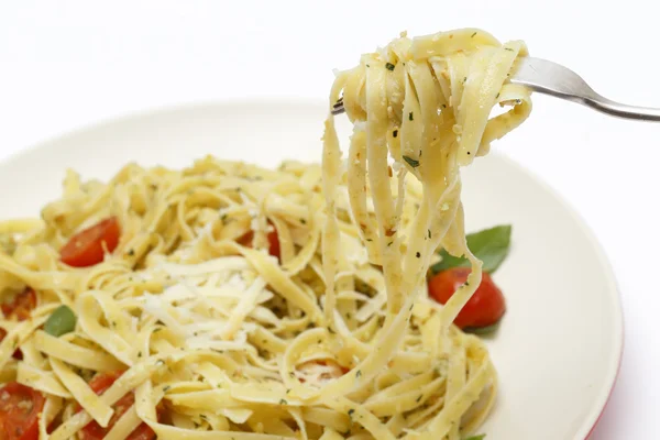Pesto tagliatelle on a fork — Stock Photo, Image