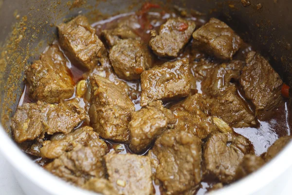 Beef madras curry cooking