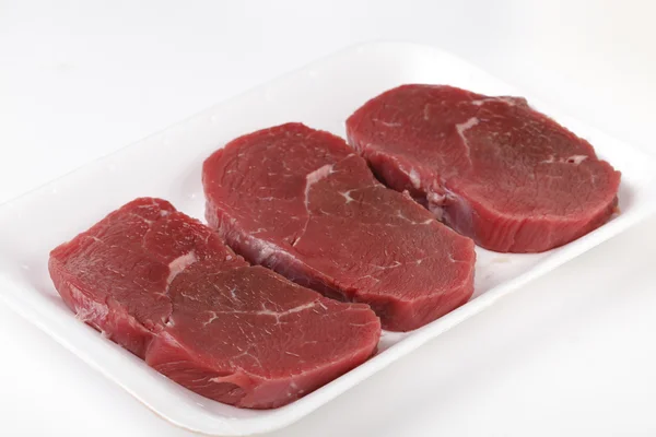 Three raw beef minute steaks — Stock Photo, Image