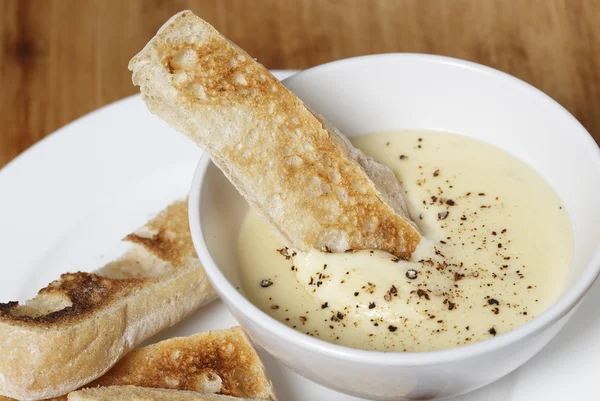 Toast in cheese dip sauce — Stock Photo, Image