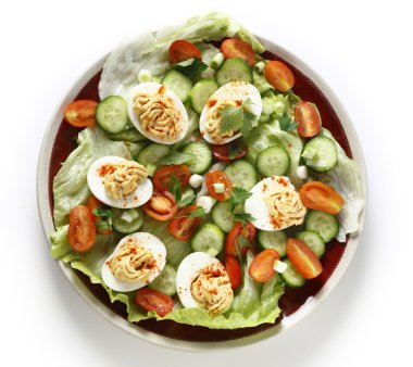 Deviled egg salad from above over white clipart