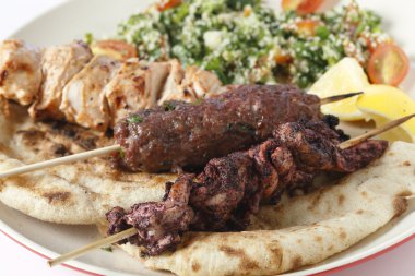 Sumac kebab kofta and taouk plate clipart