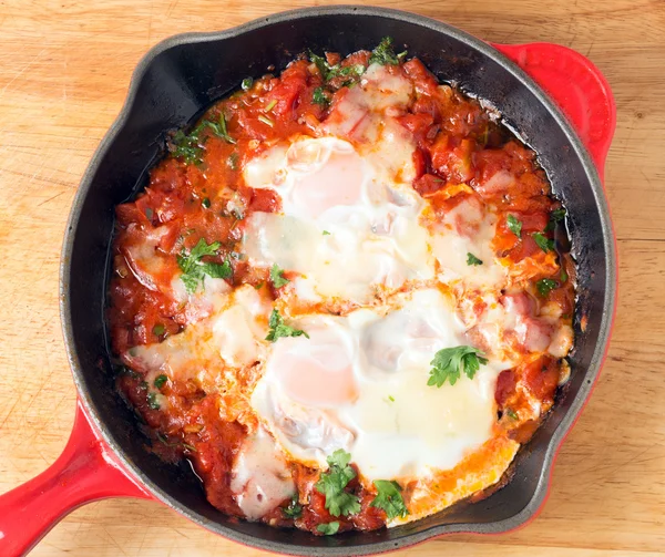 Eggs poached on tomato sauce from above — Stock Photo, Image