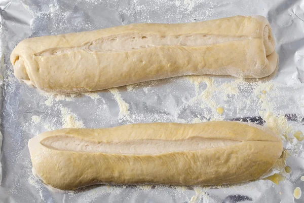 Bread dough batons rising — Stock Photo, Image