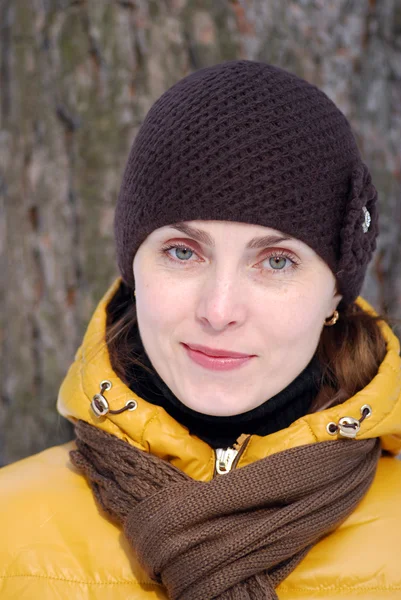 Woman in a yellow jacket — Stock Photo, Image