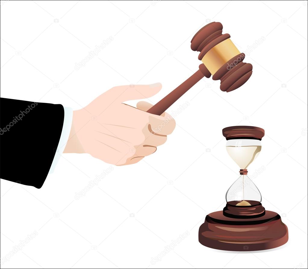 Hourglass and gavel in hand isolated on white