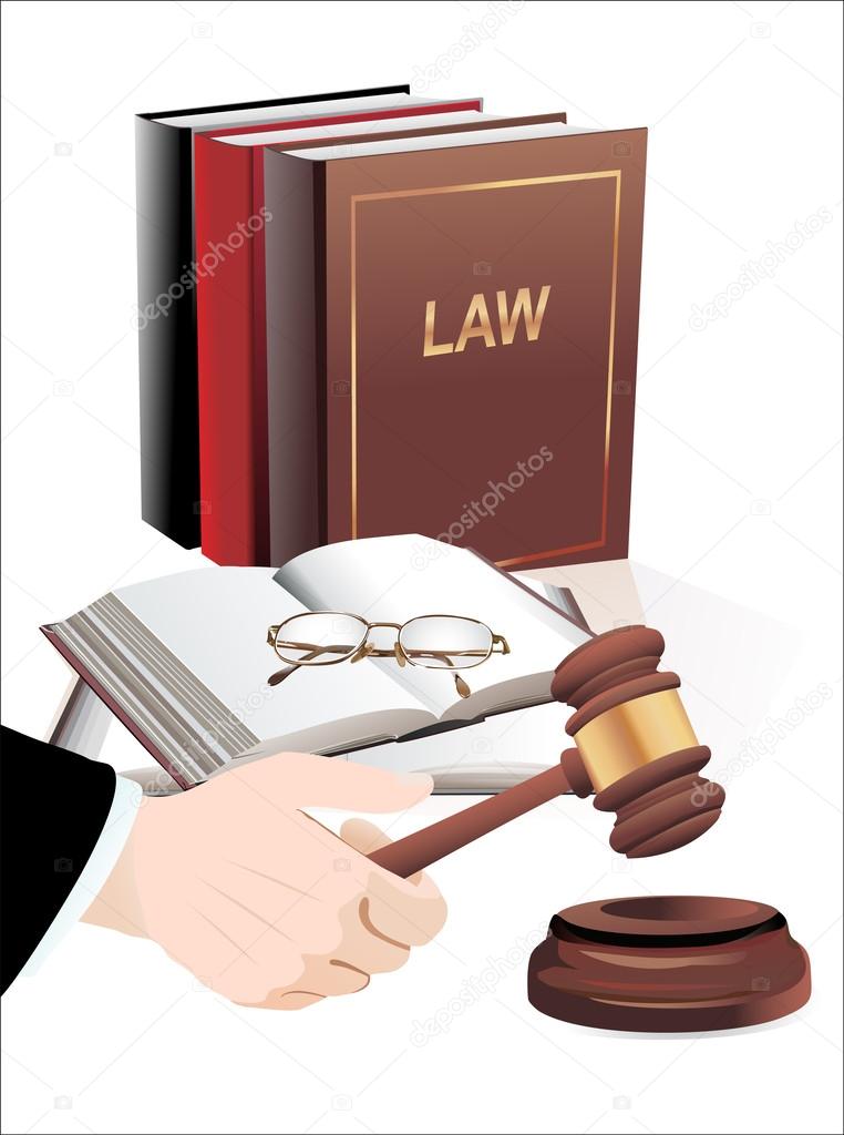 wooden gavel in hand and law books isolated on white