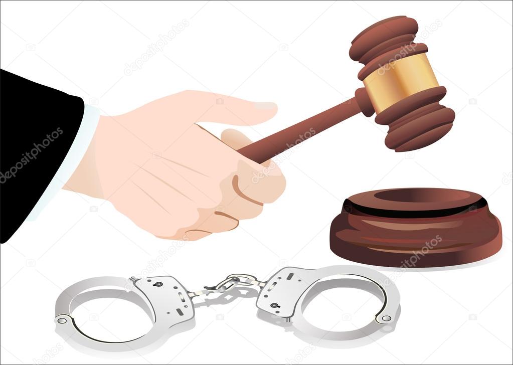 Gavel in hand and handcuffs isolated on white