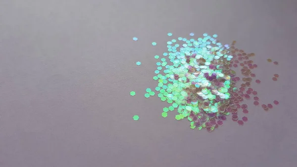 Purple Green Shiny Sequins Beige Paper Table — Stock Photo, Image