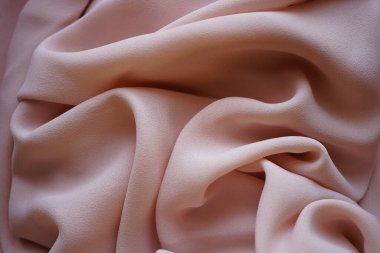 Hassas krem rengi ince şifon, bej rengi fabik dalgalar arka plan.