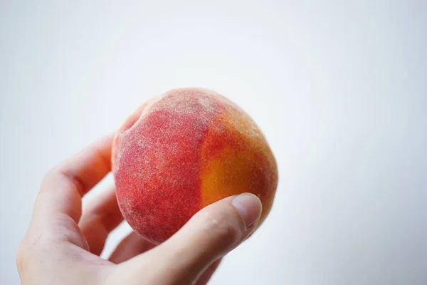 Ripe Peach Fruit Human Hand White Background — Stockfoto