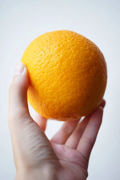 Ripe Orange Human Hand White Background — Stock Photo, Image