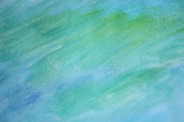 Pastel abstract background with blue green watercolor paints.