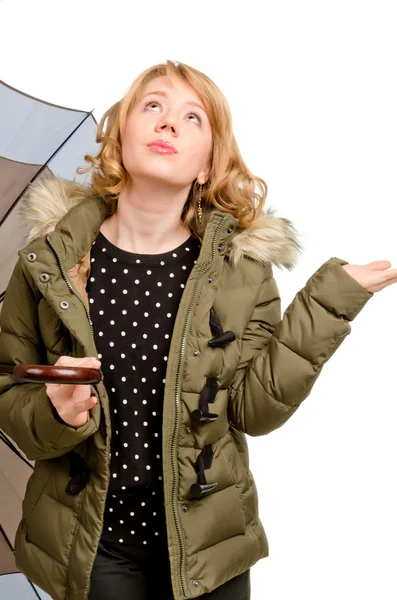 Dubious blonde woman watching the weather — Stock Photo, Image