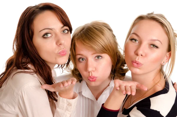 Mischievous ladies blowing kisses Royalty Free Stock Photos