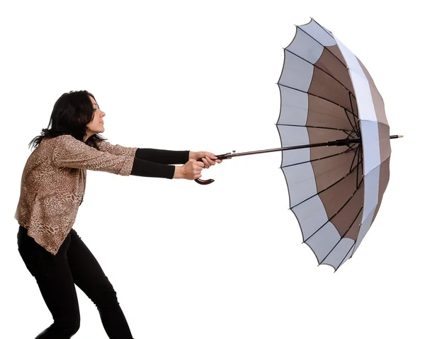 Beautiful brunette woman holding an umbrella — Stock Photo, Image