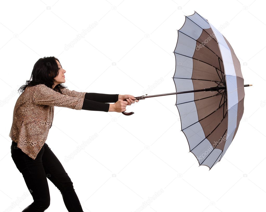 Beautiful brunette woman holding an umbrella