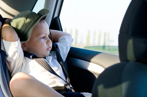 Little boy in a child safety seat — Stok fotoğraf