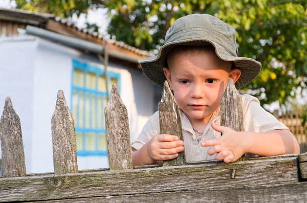 Little boy waiting for Dad to come home