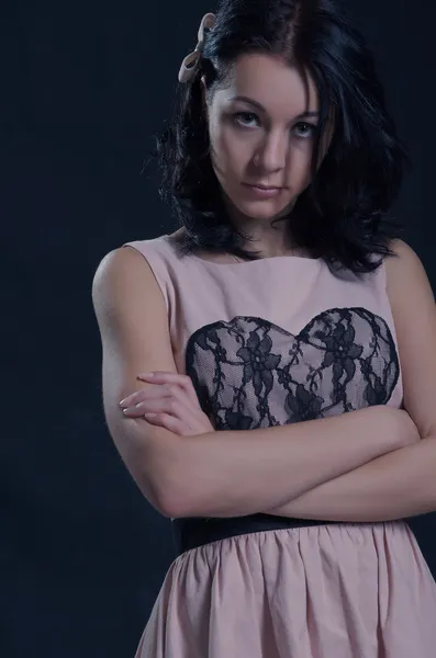 Brunette woman with arms folded — Stock Photo, Image