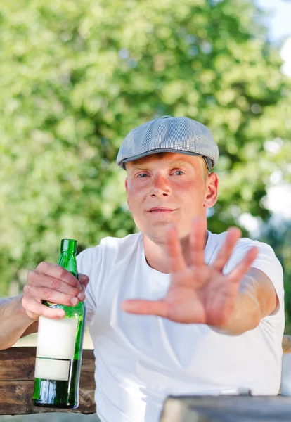 Rural drunk protesting being photographed — Stock Photo, Image