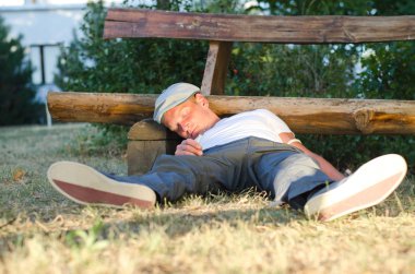 Addicted man fallen down on the ground clipart