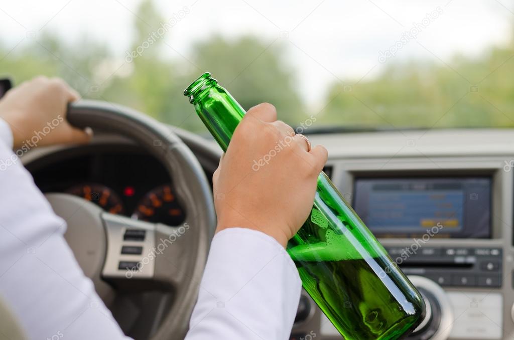 Alcoholic female driving a car