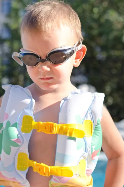Little boy in swimming goggles on a hot summer day — Stock Photo, Image