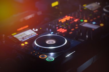 Disc Jockey mixing deck and turntables clipart