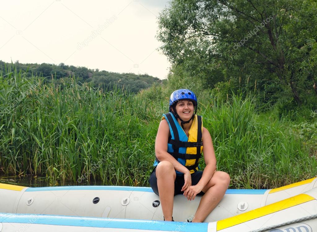 Woman going white water rafting