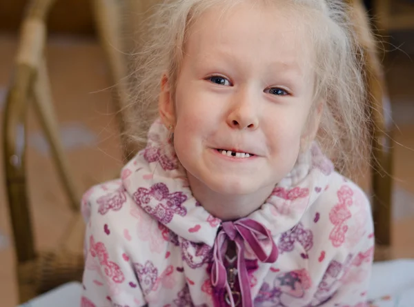 Funny little girl showing off her missing tooth — Stock Photo, Image