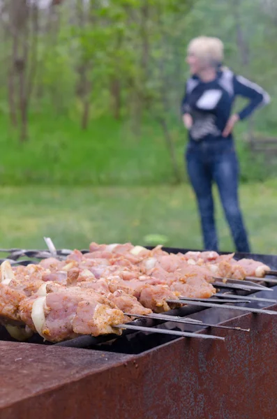 Meat kebabs cooking over a summer BBQ — Stock Photo, Image