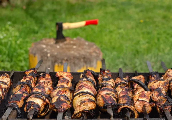 Kebabs sizzling over a hot BBQ fire — Stock Photo, Image