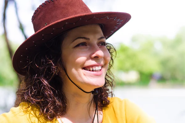 Beautiful woman in a trendy leather hat — Stock Photo, Image