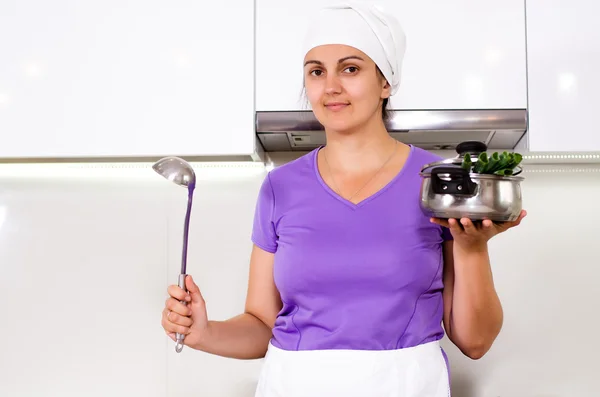 Female cook in her kitchen — Stock Photo, Image