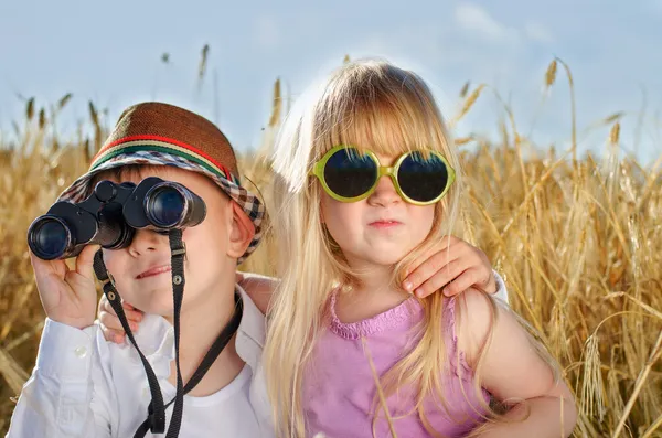 Two cute little sweethearts playing outdoors — Stock Photo, Image