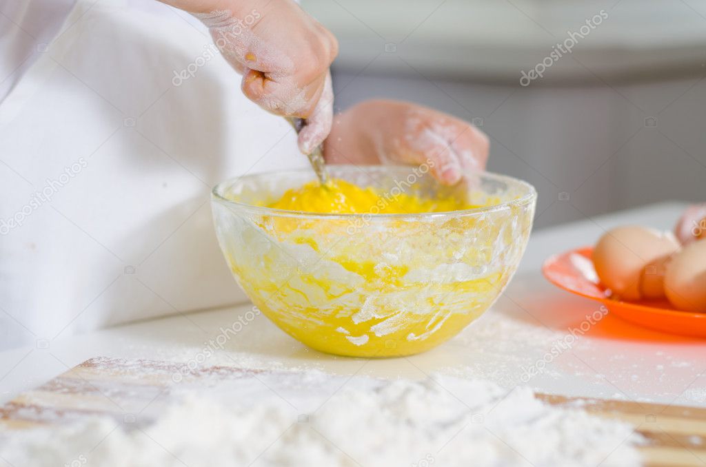 Little boy mixing cake ingredients — Stock Photo © ampack 49422605
