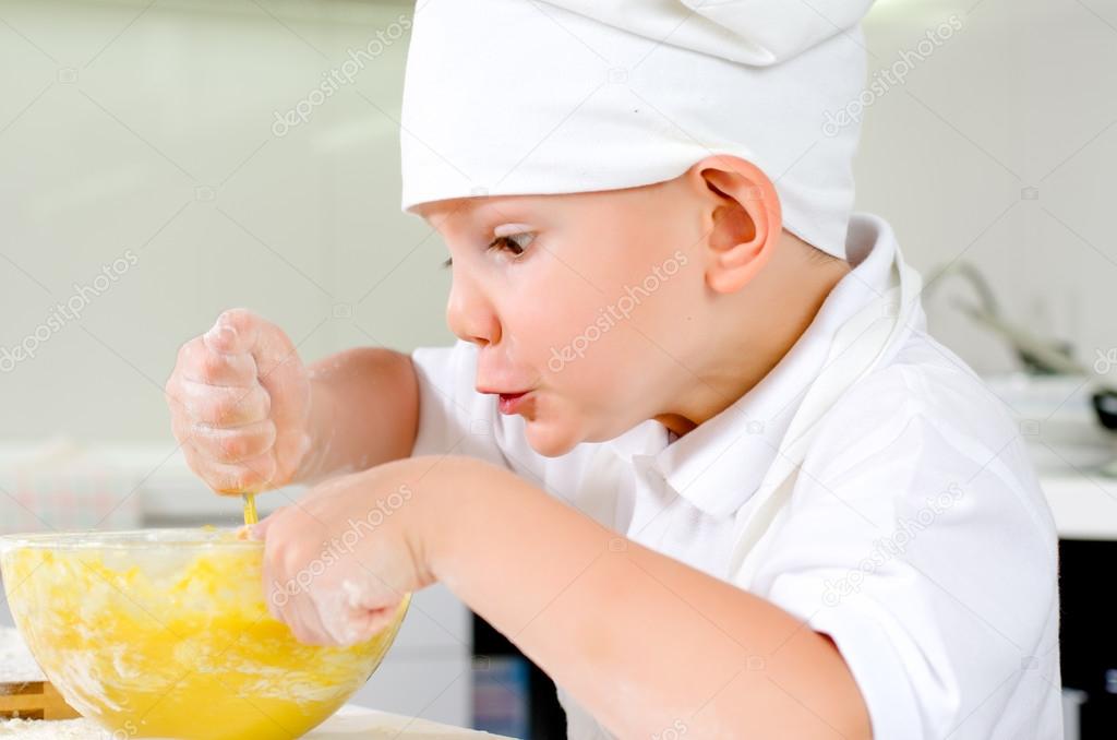 Gleeful young chef baking in the kitchen