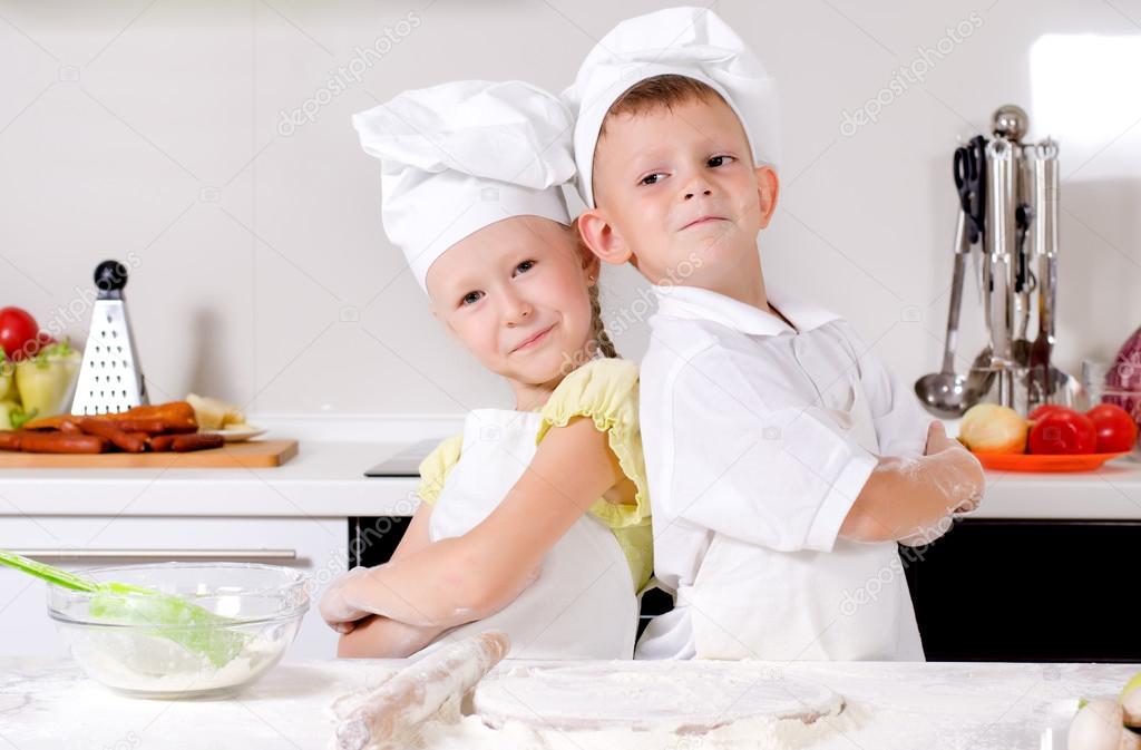 Two cute proud young chefs